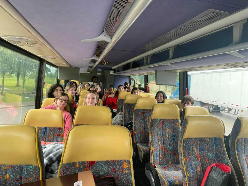 Upward Bound students ride together on the bus